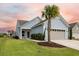Light blue house with gray garage and palm tree in front yard at 531 Switchgrass Dr, Summerville, SC 29486