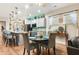Eat-in kitchen with granite island, stainless steel appliances, and hardwood floors at 531 Switchgrass Dr, Summerville, SC 29486