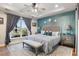 Main bedroom with king bed, ensuite bathroom, and large window with pool view at 531 Switchgrass Dr, Summerville, SC 29486