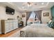 Main bedroom with large dresser, king bed and pool view at 531 Switchgrass Dr, Summerville, SC 29486