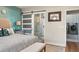 Main bedroom with king bed and barn door leading to en suite bathroom and laundry room at 531 Switchgrass Dr, Summerville, SC 29486