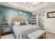 Main bedroom with king bed and barn door leading to en suite bathroom at 531 Switchgrass Dr, Summerville, SC 29486