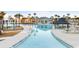 Large resort pool with hot tub and shaded seating areas at 531 Switchgrass Dr, Summerville, SC 29486