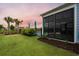 Private backyard with a screened porch and lush landscaping at 531 Switchgrass Dr, Summerville, SC 29486