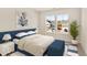 Bedroom with a navy upholstered bed and window overlooking the community at 569 Richfield Way, Summerville, SC 29486