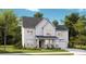 Two-story home with gray shingle roof, white siding, and brick accents at 569 Richfield Way, Summerville, SC 29486