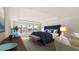 Main bedroom with a navy blue upholstered bed and large windows at 569 Richfield Way, Summerville, SC 29486