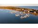Aerial view of waterfront homes and a marina with many boats at 67 W We 10Th St # A-8, Folly Beach, SC 29439