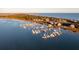 Aerial view of waterfront homes and a marina with many boats at 67 W We 10Th St # A-8, Folly Beach, SC 29439