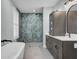 Elegant bathroom with a soaking tub and a walk-in shower at 711 Blueway Ave, Summerville, SC 29486