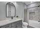 Modern bathroom with gray tile shower and bathtub at 711 Blueway Ave, Summerville, SC 29486