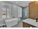 Spa-like bathroom featuring a freestanding tub and stylish shower at 711 Blueway Ave, Summerville, SC 29486