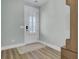 Bright entryway with white door, light walls, and wood flooring at 711 Blueway Ave, Summerville, SC 29486
