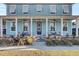 Charming light blue house with a front porch and landscaping at 711 Blueway Ave, Summerville, SC 29486