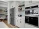 Modern kitchen with stainless steel appliances and white cabinets at 711 Blueway Ave, Summerville, SC 29486