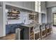 Modern kitchen island with stylish woven barstools and a breakfast bar at 711 Blueway Ave, Summerville, SC 29486