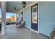 Front porch with two wicker chairs and a view of the neighborhood at 711 Blueway Ave, Summerville, SC 29486