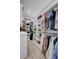 Large walk-in closet with custom shelving and hanging rods at 711 Blueway Ave, Summerville, SC 29486