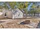 Backyard with fire pit and trees at 7936 Vermont Rd, North Charleston, SC 29418
