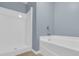Bathroom with white tub and shower unit at 7936 Vermont Rd, North Charleston, SC 29418
