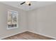 Bright bedroom with wood-look floors and window at 7936 Vermont Rd, North Charleston, SC 29418