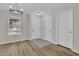 Light and bright entryway with wood-look floors and chandelier at 7936 Vermont Rd, North Charleston, SC 29418
