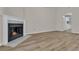 Gas fireplace with white surround in living room at 7936 Vermont Rd, North Charleston, SC 29418