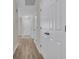 Hallway with light walls and wood-look floors at 7936 Vermont Rd, North Charleston, SC 29418