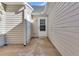 Side patio area with access door at 7936 Vermont Rd, North Charleston, SC 29418