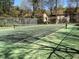 Community tennis court with green surface and chain-link fence at 7936 Vermont Rd, North Charleston, SC 29418