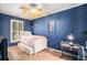 Blue bedroom with a twin bed, desk, and TV at 882 Sedge Ct, Charleston, SC 29412
