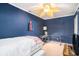 Blue bedroom with twin bed and workspace at 882 Sedge Ct, Charleston, SC 29412