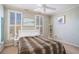Bedroom with leopard print comforter and ceiling fan at 882 Sedge Ct, Charleston, SC 29412