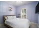 Cozy bedroom with white bedding and a large window at 882 Sedge Ct, Charleston, SC 29412