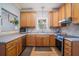 L-shaped kitchen, stainless steel appliances, oak cabinets at 882 Sedge Ct, Charleston, SC 29412