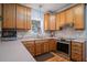 Bright kitchen with stainless steel appliances and oak cabinets at 882 Sedge Ct, Charleston, SC 29412