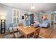 Open living and dining area with hardwood floors and sectional sofa at 882 Sedge Ct, Charleston, SC 29412