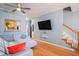 Living room with hardwood floors, sectional sofa and stairs at 882 Sedge Ct, Charleston, SC 29412
