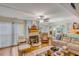 Relaxing living room with hardwood floors, a fireplace and ample natural light at 10 Chapman Ave, Isle of Palms, SC 29451