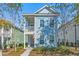 Two-story light blue house with front porch and landscaping at 103 Green Grass Rd, Summerville, SC 29483