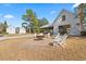Fire pit with chairs near community pavilion at 103 Green Grass Rd, Summerville, SC 29483