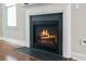 Modern gas fireplace with dark stone surround at 103 Green Grass Rd, Summerville, SC 29483