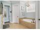 Spacious bathroom with a luxurious soaking tub and tile flooring at 1034 Bradbury Ln, Charleston, SC 29492