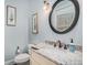 Elegant powder room with granite vanity and a large mirror at 1034 Bradbury Ln, Charleston, SC 29492