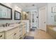 Elegant bathroom features double sinks, granite counters, and a large shower at 1034 Bradbury Ln, Charleston, SC 29492