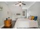 Bright bedroom with a queen-size bed, wooden nightstand, and a window with natural light at 1034 Bradbury Ln, Charleston, SC 29492