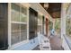 Inviting front porch with rocking chairs and lush greenery at 1034 Bradbury Ln, Charleston, SC 29492