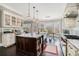 Open kitchen with large island, custom cabinetry, and granite countertops at 1034 Bradbury Ln, Charleston, SC 29492
