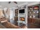 Spacious living room featuring a fireplace, built-in shelving, and hardwood floors at 1034 Bradbury Ln, Charleston, SC 29492