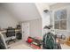 Small attic office space with a desk, chair, and some storage at 1034 Bradbury Ln, Charleston, SC 29492